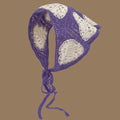 Purple and white crochet pet bonnet with heart patterns and tie strings